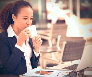 computer businesswoman drinking coffee